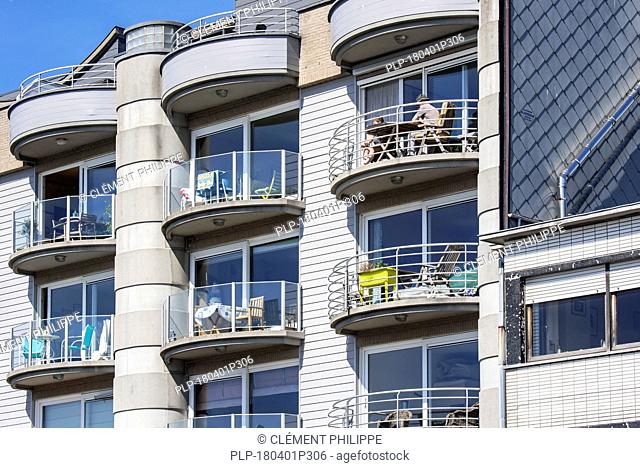 Modern flats / apartments / apartment block at seaside resort Zeebrugge / Zeebruges along the North Sea coast, West Flanders, Belgium