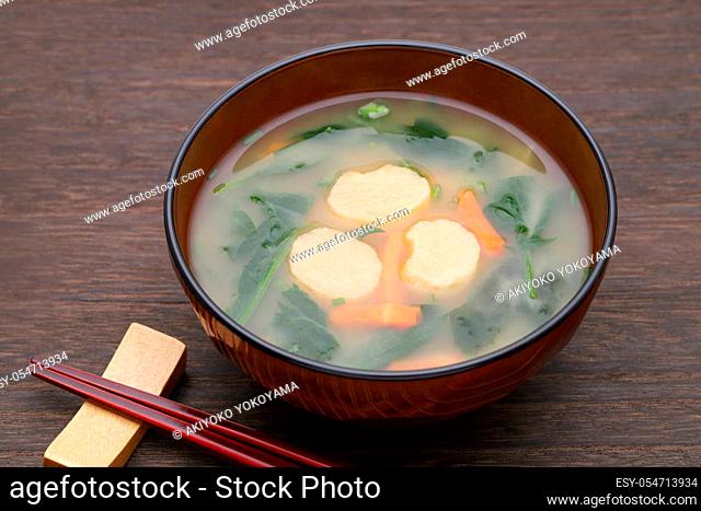 Japanese food, Miso soup of fu and vegetables in a bowl on table
