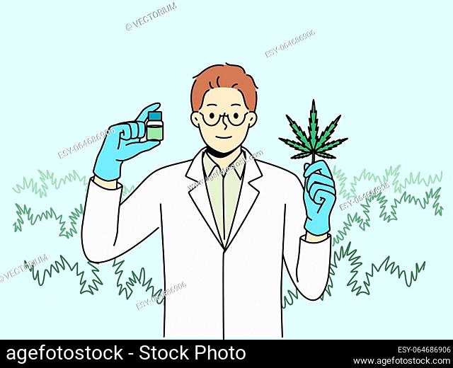 Man biologist with cannabis oil, produced from petals of narcotic plant, recommending legalization of marijuana. Doctor in white coat demonstrates cannabis leaf...