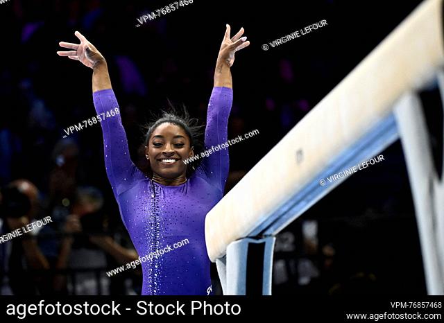 US Simone Biles smiles at the end of her pass at the women's pictured at balance beam competition a soccer match between Standard de Liege and Club Brugge