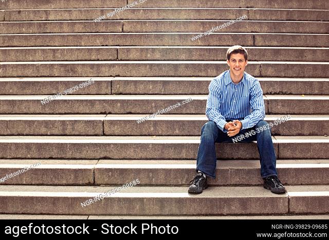 Teenager posing on stairs