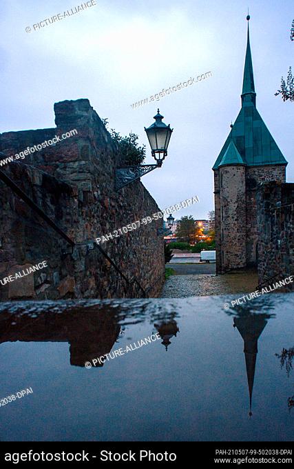 07 May 2021, Saxony-Anhalt, Magdeburg: The morning dawns over the Magdalen Chapel after a rainy night. The region is in for a significant change in the weather