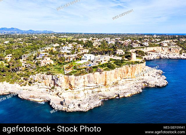 Spain, Mallorca, Santanyi, Drone view of coastal village in summer