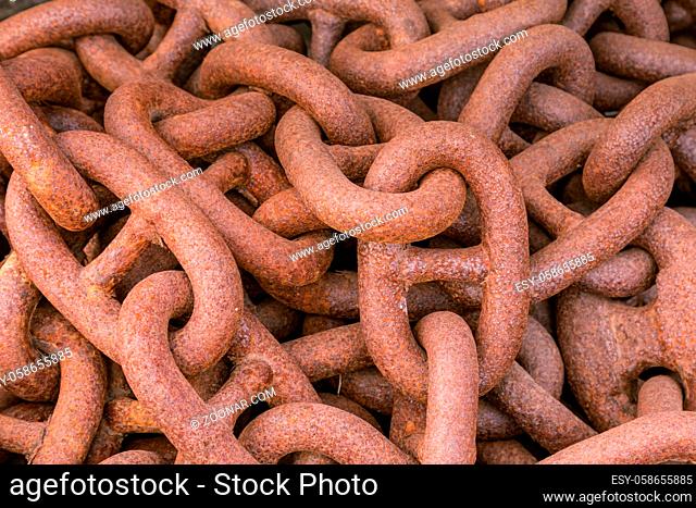 Closeup of pile of big rusty chains