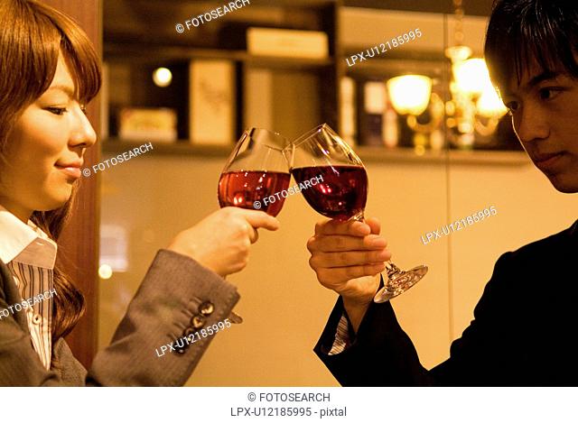 Couple toasting wineglasses