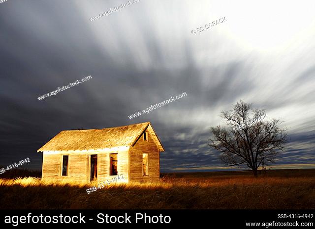Night view of abandoned ranch house