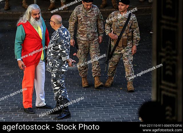 10 November 2022, Lebanon, Beirut: Lebanese presidential candidate and activist Milad Abu Malhab (L), sporting a multi-colored suit