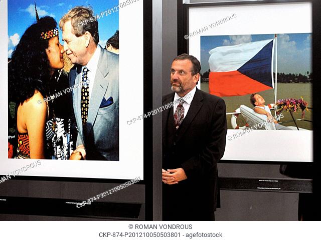 CEO of the Czech News Agency Jiri Majstr observes the exhibition of Vaclav Havel photographs by reporters of the Czech News Agency which accompany a ceremony to...