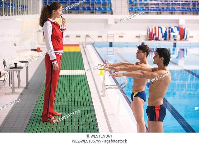 Young woman training two athletes