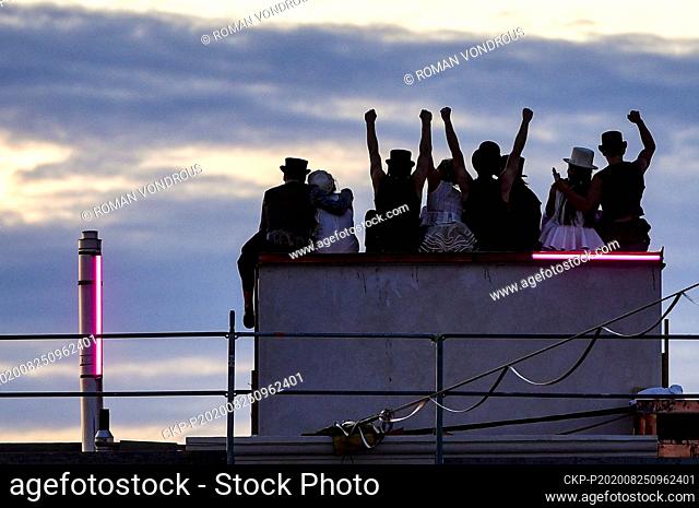 Acrobats perform during the filming of Andersen's fairy tale The Shepherdess and the Chimney Sweep, on August 25, 2020, on the roofs of the Lucerna Palace in...