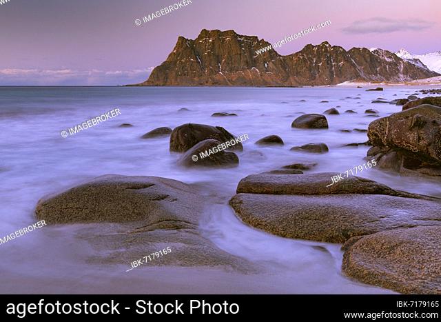 Winter coastal landscape with stormy sea, rocks, long exposure, Uttakleiv strand, Leknes, Nordland, Lofoten, Norway, Europe
