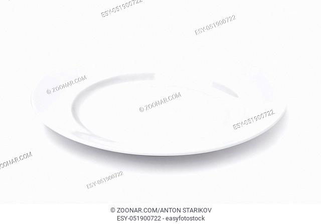White round empty dinner plate isolated on white
