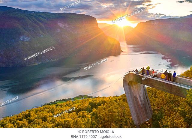 People admiring sunset from Stegastein viewpoint platform above the fjord, aerial view, Aurlandsfjord, Sogn og Fjordane county, Norway, Scandinavia, Europe