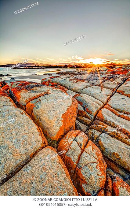 landscape in The Gardens, Bay of Fires consevation Area, east coast of Tasmania in Australia. White sandy beach with turquoise crystal waters and orange lichen...