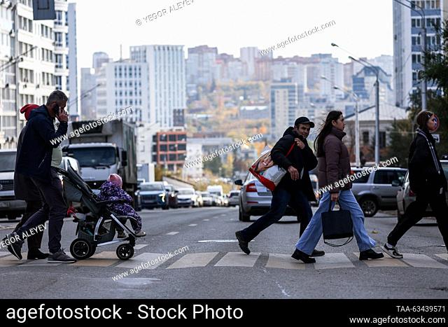 RUSSIA, UFA - OCTOBER 16, 2023: People cross Zaki Validi Street. Yegor Aleyev/TASS