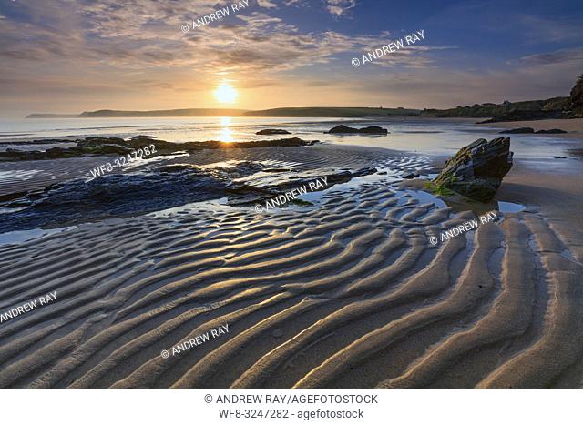 Sunrise captured from the western side of Harlyn Bay Beach, , near Padstow on the North coast of Cornwall
