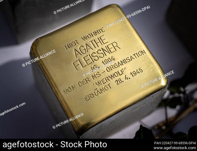 27 April 2022, Bavaria, Penzberg: A ""Stolperstein"" made by the artist Gunter Demnig lies on a table in front of the town hall of Penzberg before being laid