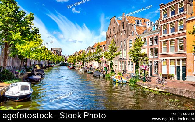 Leiden, Netherlands - July 22, 2020: Cityscape Leiden view Old Rhine with canal, houses and Saint Jan bridge during the summer