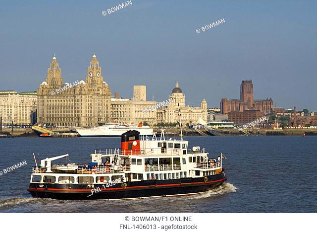 Ship in river with buildings in background, Cunard Building, Royal Liver Building, River Mersey, Liverpool, Merseyside, North West England, England