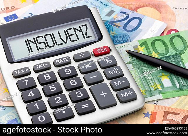 Calculator with euro bills - Insolvency - Insolvenz (German)