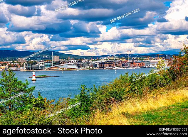 Oslo, Ostlandet / Norway - 2019/09/02: Panoramic view of metropolitan Oslo city center seen from Hovedoya island on Oslofjord harbor