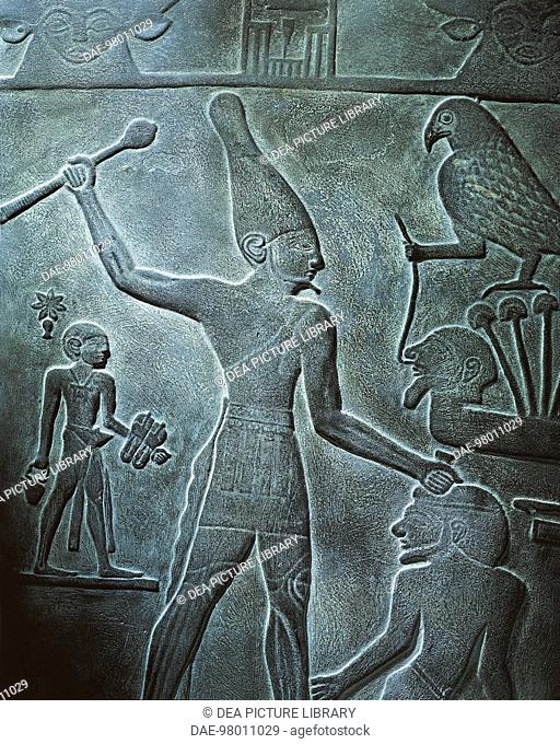 Egyptian civilization, Early Dynastic Period, Dynasty I. Cast of Narmer Palette. Detail: the king with the white crown brandishing a mace about to hit an enemy