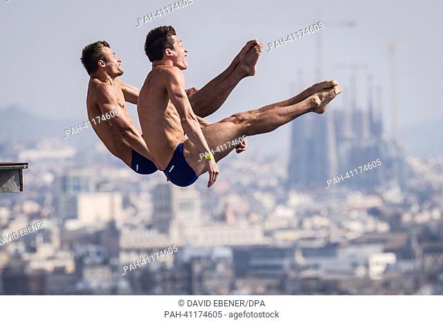 Patrick Hausding (Front) and Sascha Klein of Germany in action during the men's 10m Synchro Platform diving preliminaries of the 15th FINA Swimming World...