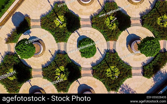 Vertical aerial top down view shot and looking down on intersection in the city park, Victory Park, Odessa, Ukraine, May5, 2019