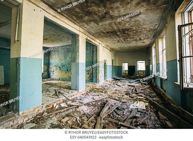 The Ruined Hall Of Abandoned Rural School After Chernobyl Disaster In Evacuation Zone. The Terrible Consequences Of The Nuclear Pollution Twenty Years Later