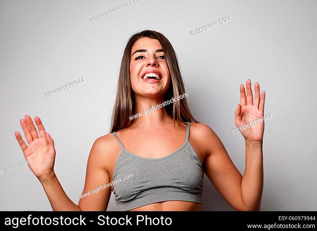 Happy young woman.Isolated over white wall. High quality photo