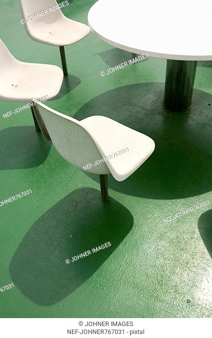 Chairs around a table on a ferry