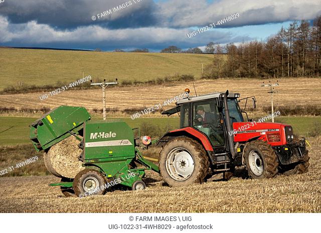 Baling straw with McHale round baler and Massey Fergusson tractor. (Photo by: Wayne Hutchinson/Farm Images/UIG)