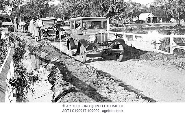 Negative - Darling River, New South Wales, 1931, Cars on an embankment beside the flooded Darling River