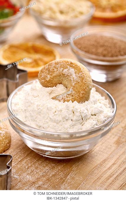 Baking ingredients, vanilla crescent shaped biscuit in flour