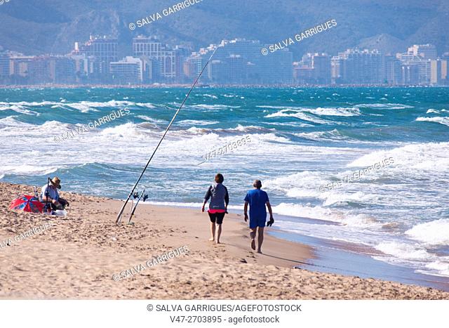 Man fishing on the beach of Cullera, Valencia, Spain. Europe