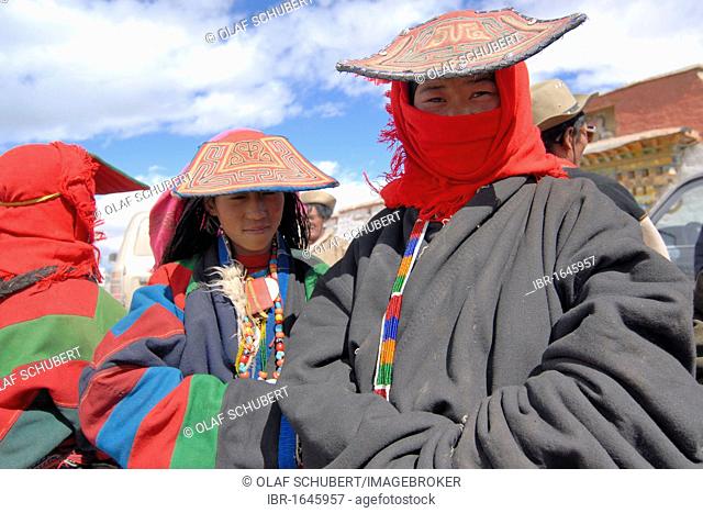 Tibetan women with traditional head coverings, fur caps and peaked caps, a group of pilgrims on a pilgrimage to the Manasarovar lake near the holy Mount Kailash