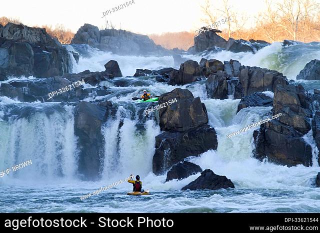 Kayakers running Great Falls of the Potomac River.; Great Falls, Maryland