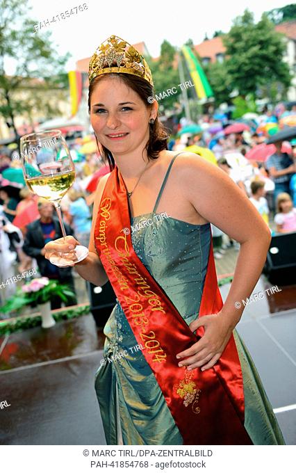 The new Thuringian Wine Princess of 2013/14, Sandra Warzeschka, stands onstage after the coronation in Bad Sulza, Germany, 18 August 2013