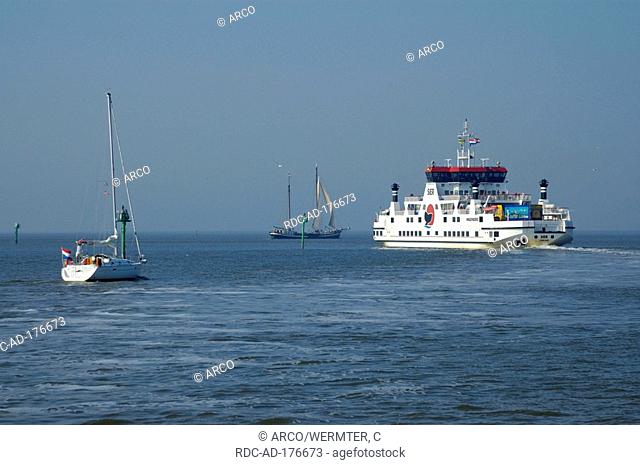 Ferry and sailing boats, near Nes, Ameland, Frisia, Netherlands, North Sea