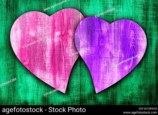 Happy valentines day colorful wooden background with coloured hearts