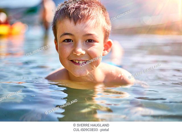Boy playing in lake