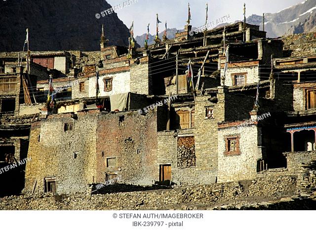 Nested houses made of stones with flat roofs and prayer flags Nar Nar-Phu Annapurna Region Nepal