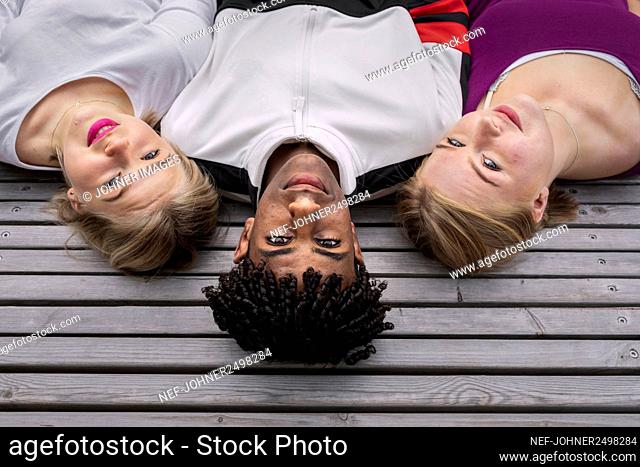 High angle view of teenage friends looking at camera