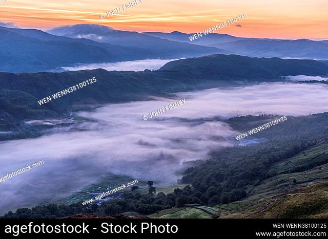 The Lake District seen at its best with stunning views across the Cambrian mountains, heather in full bloom, mist covered valleys and warm light at sunrise