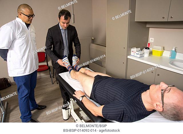 Reportage in Nollet Clinic in Paris, France. Post-op consultation (hip replacement) with Dr Nogier, a hip surgeon. An examination of symmetry