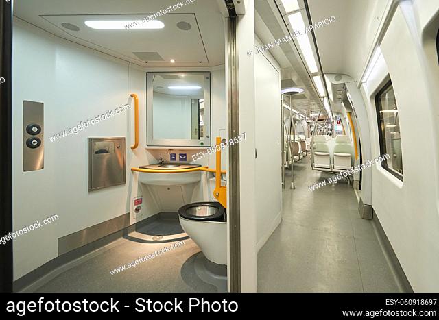 View of the toilets and corridor in a modern train without people