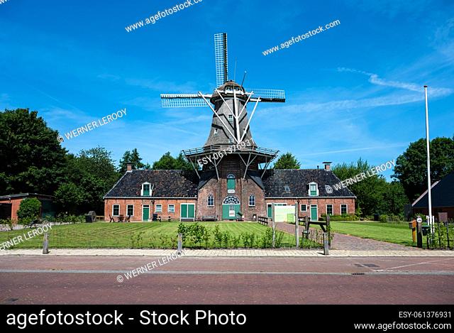 Onlanden, Drenthe, The Netherlands - Traditional windmill against blue sky at the Dutch countryside