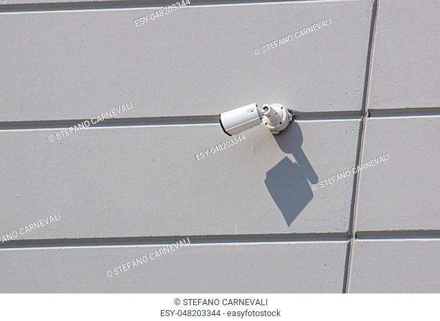 security camera working on the wall of a building