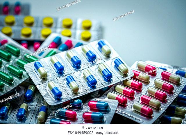 Pile of antibiotic capsule pills in blister pack. Pharmaceutical packaging. Medicine for infections disease. Antibiotic drug used in food animals at animals...
