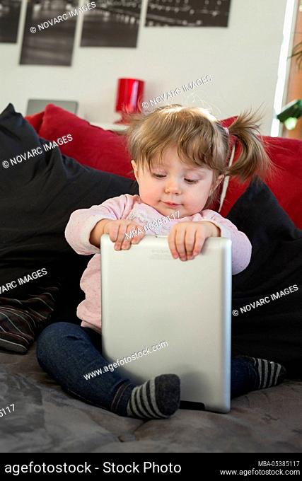 Little girl with tablet pc